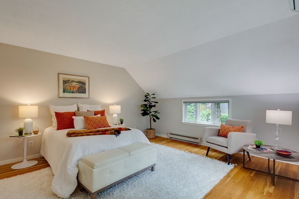 41 Todd Pond Road, Unit 41 Lincoln, MA 01773 - Photo 4 of 26 a bedroom with a bed and wooden floor