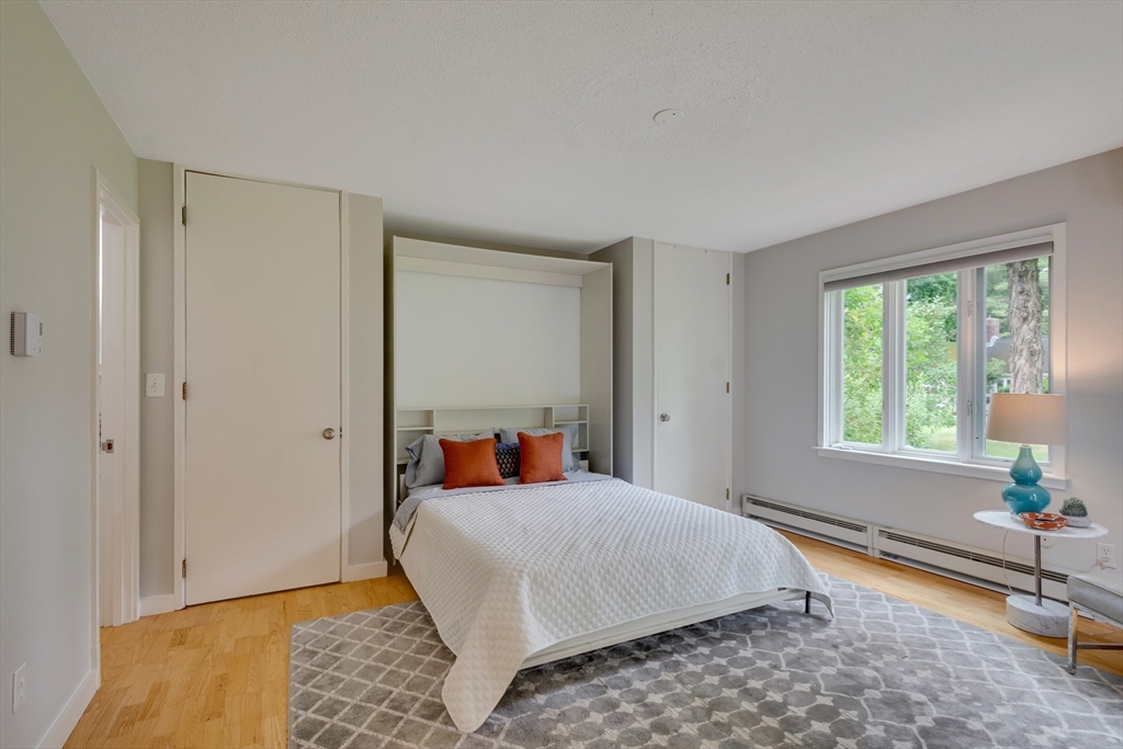 41 Todd Pond Road, Unit 41 Lincoln, MA 01773 - Photo 5 of 26 a bedroom with a bed and a window