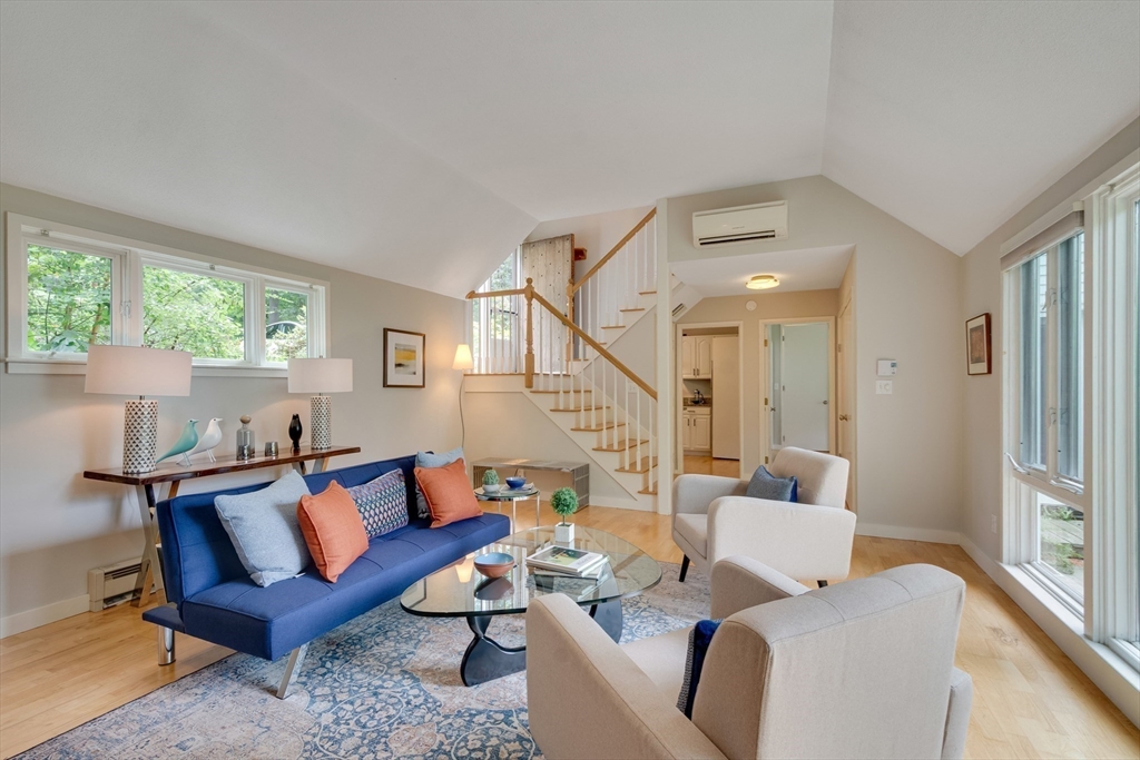 41 Todd Pond Road, Unit 41 Lincoln, MA 01773 - Photo 6 of 26 a living room with furniture and a large window