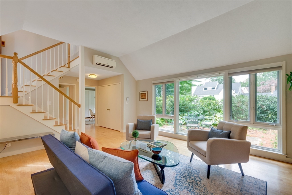 41 Todd Pond Road, Unit 41 Lincoln, MA 01773 - Photo 7 of 26 a living room with furniture and a large window