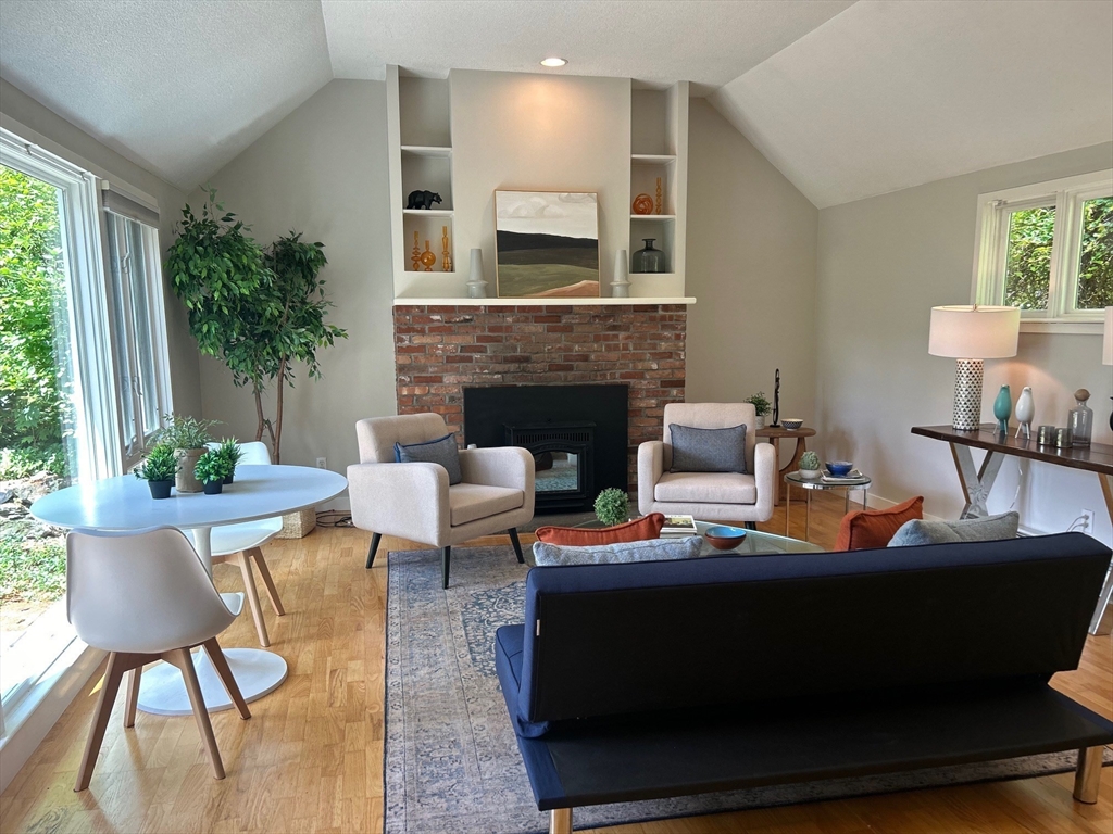 41 Todd Pond Road, Unit 41 Lincoln, MA 01773 - Photo 8 of 26 a living room with furniture and a fireplace