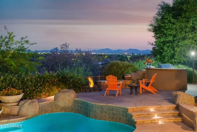 an outdoor sitting area with couch and outdoor seating