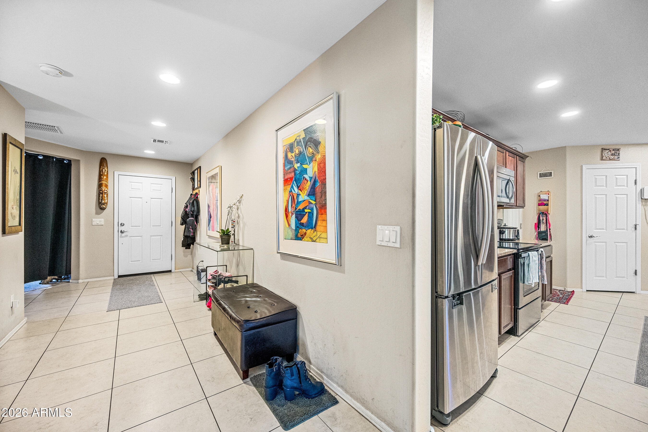 867 South Swallow Lane Gilbert, AZ 85296 - Photo 3 of 33 Front Entry Hall to Kitchen