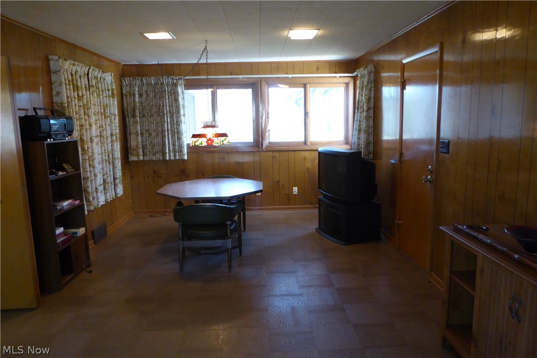 12964 Sperry Road Chesterland, OH 44026 - Photo 10 of 23 Huge Paneled Family Room, Wood Floors, Wall of Windows, Entrance from Garage, Convenient Dining Area As Well.