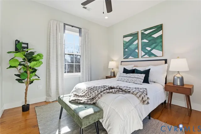 a bedroom with a bed and a window