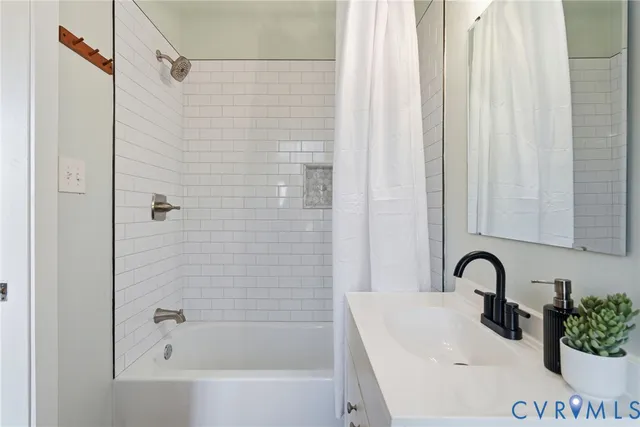 a bathroom with a sink and a bathtub