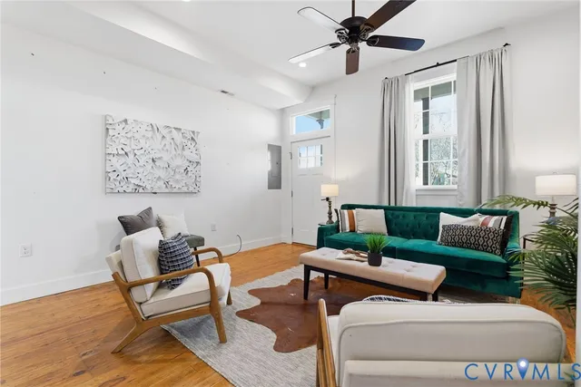 a living room with furniture and a window