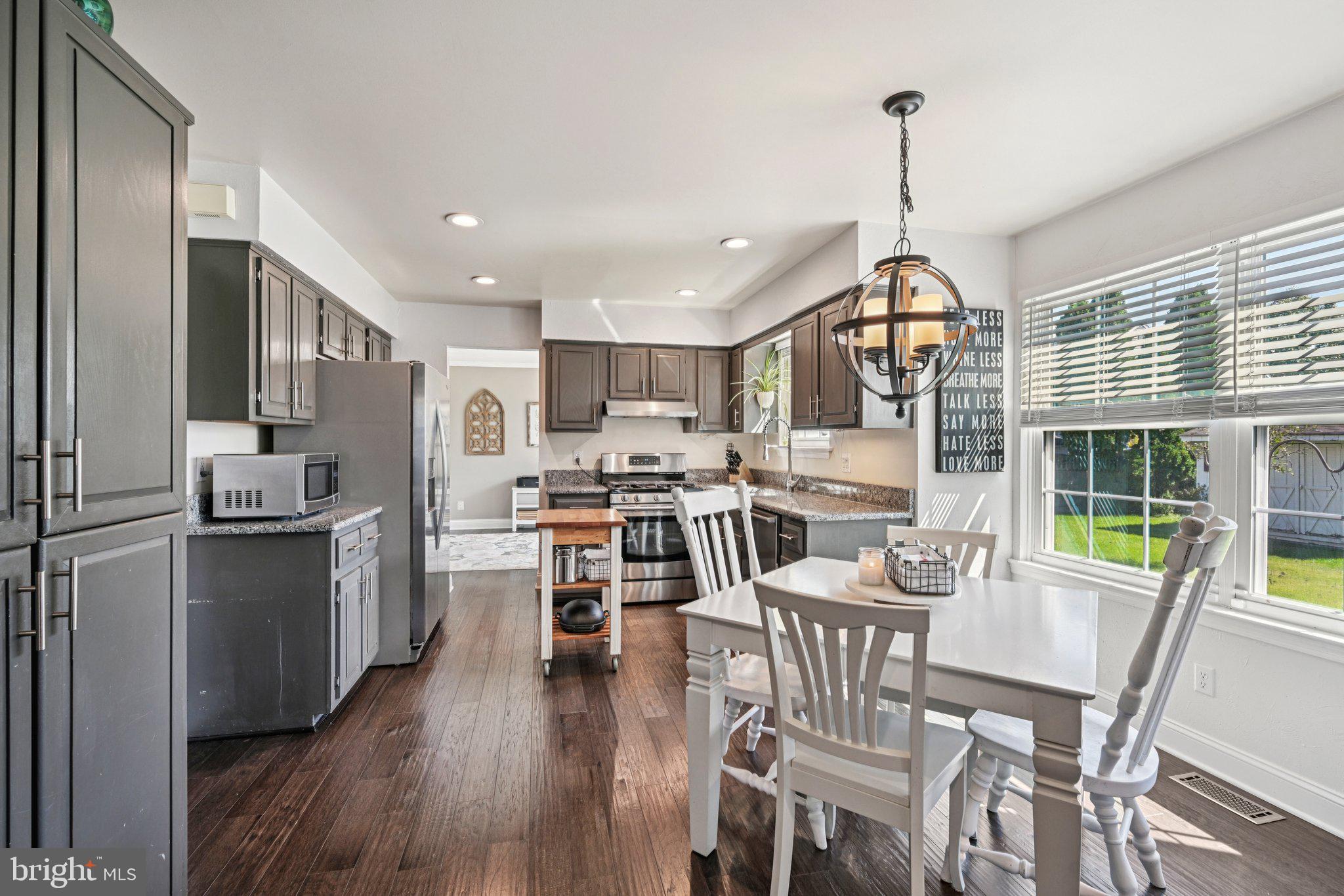 39 Willow Ridge Road Marlton, NJ 08053 - Photo 11 of 43 a view of a dining room and livingroom with furniture wooden floor a chandelier