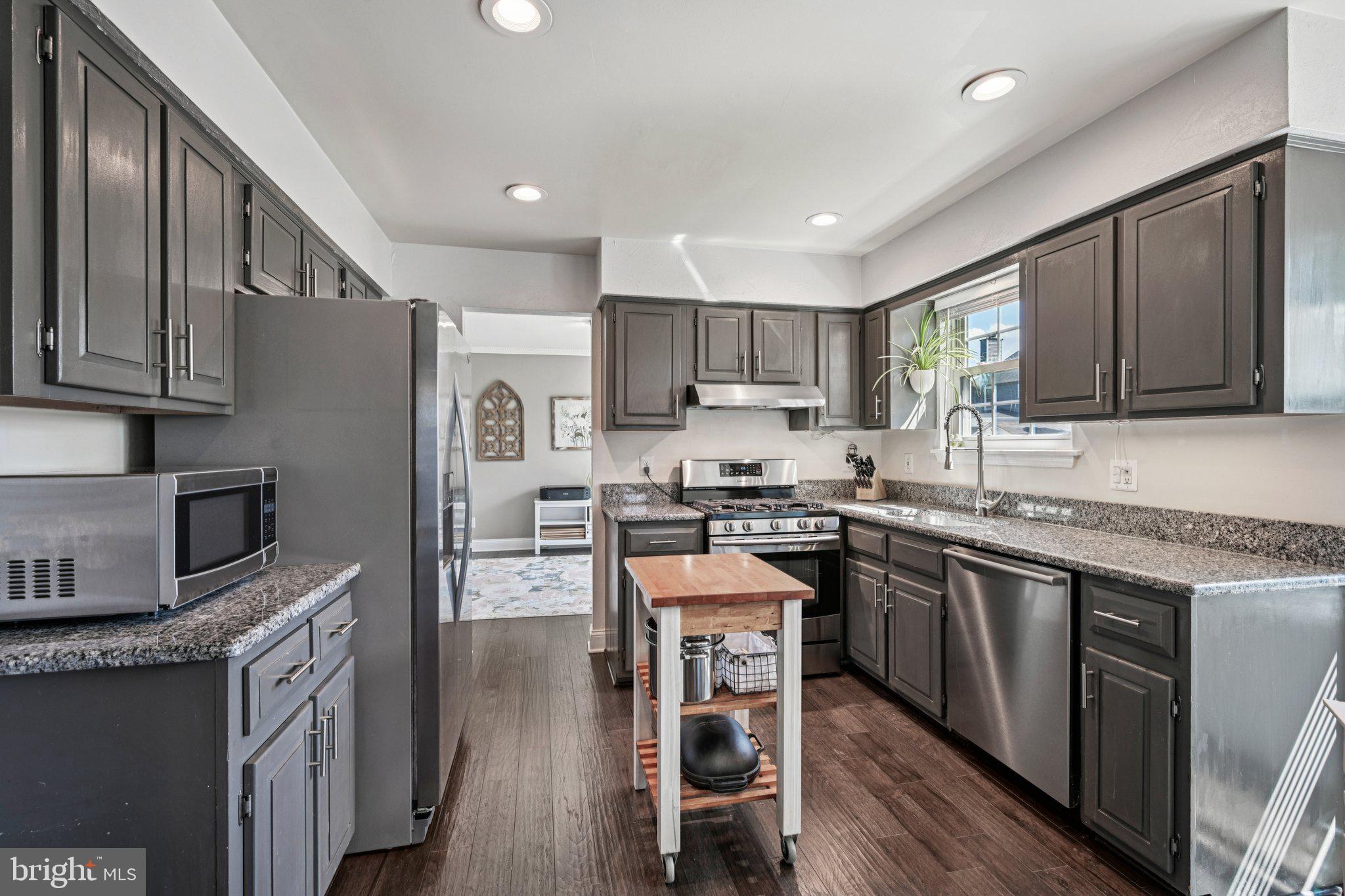 39 Willow Ridge Road Marlton, NJ 08053 - Photo 14 of 43 a kitchen with stainless steel appliances granite countertop wooden cabinets a refrigerator a stove a sink and a oven