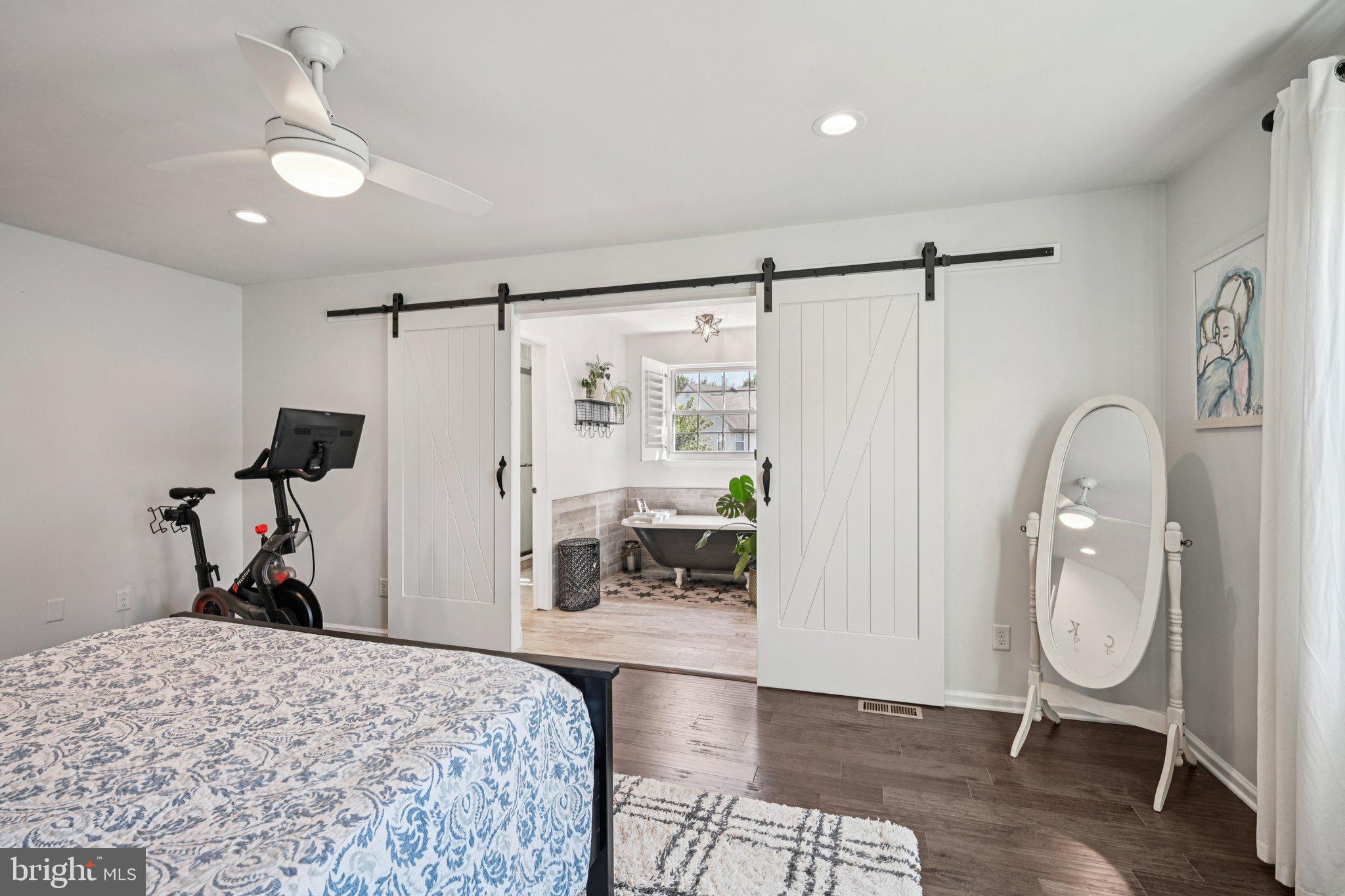 39 Willow Ridge Road Marlton, NJ 08053 - Photo 33 of 43 a bedroom with a bed a mirror and a table in it