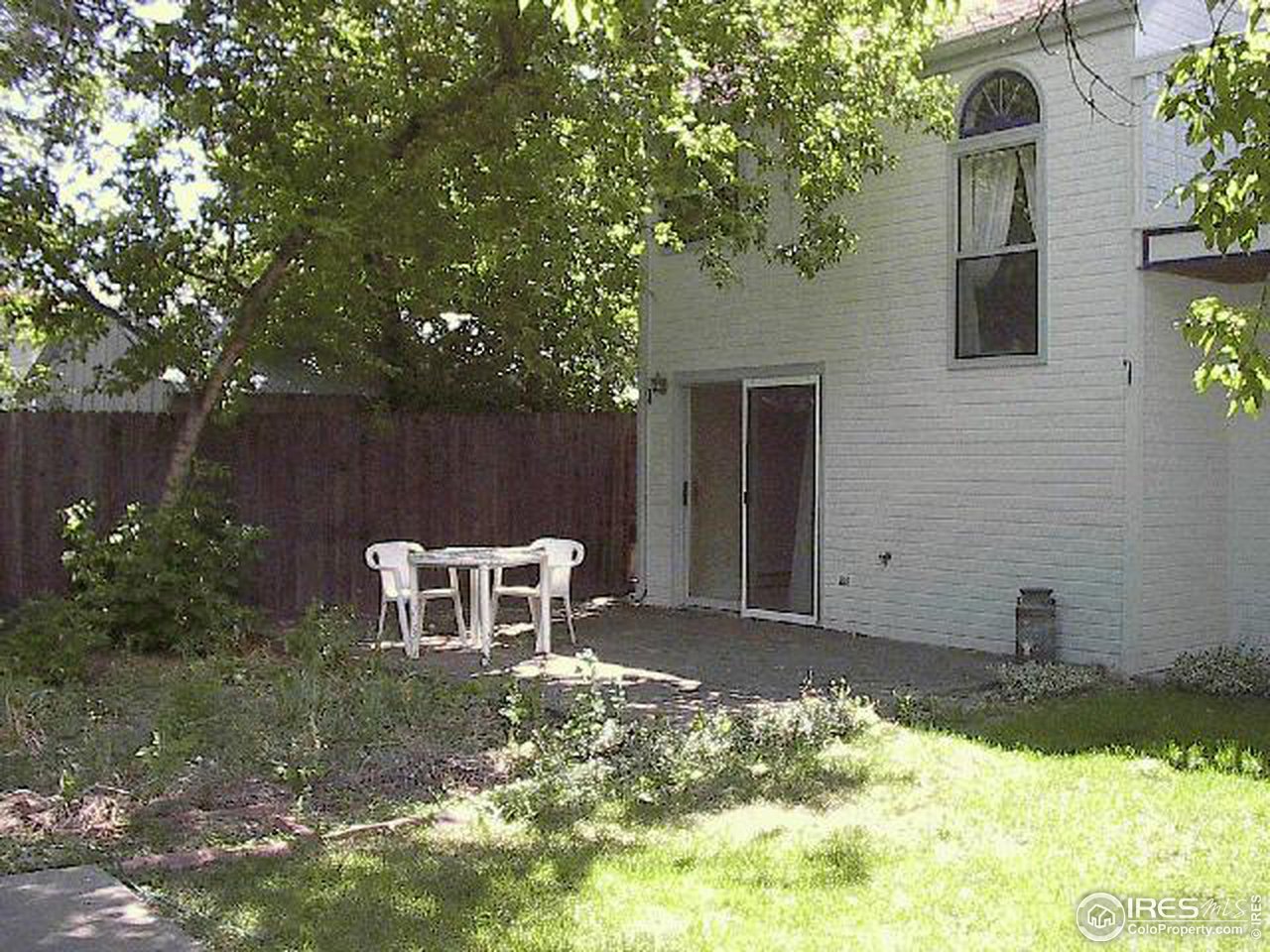 2607 Mapleton Avenue Boulder, CO 80304 - Photo 2 of 3 a view of a backyard with chair and potted plants