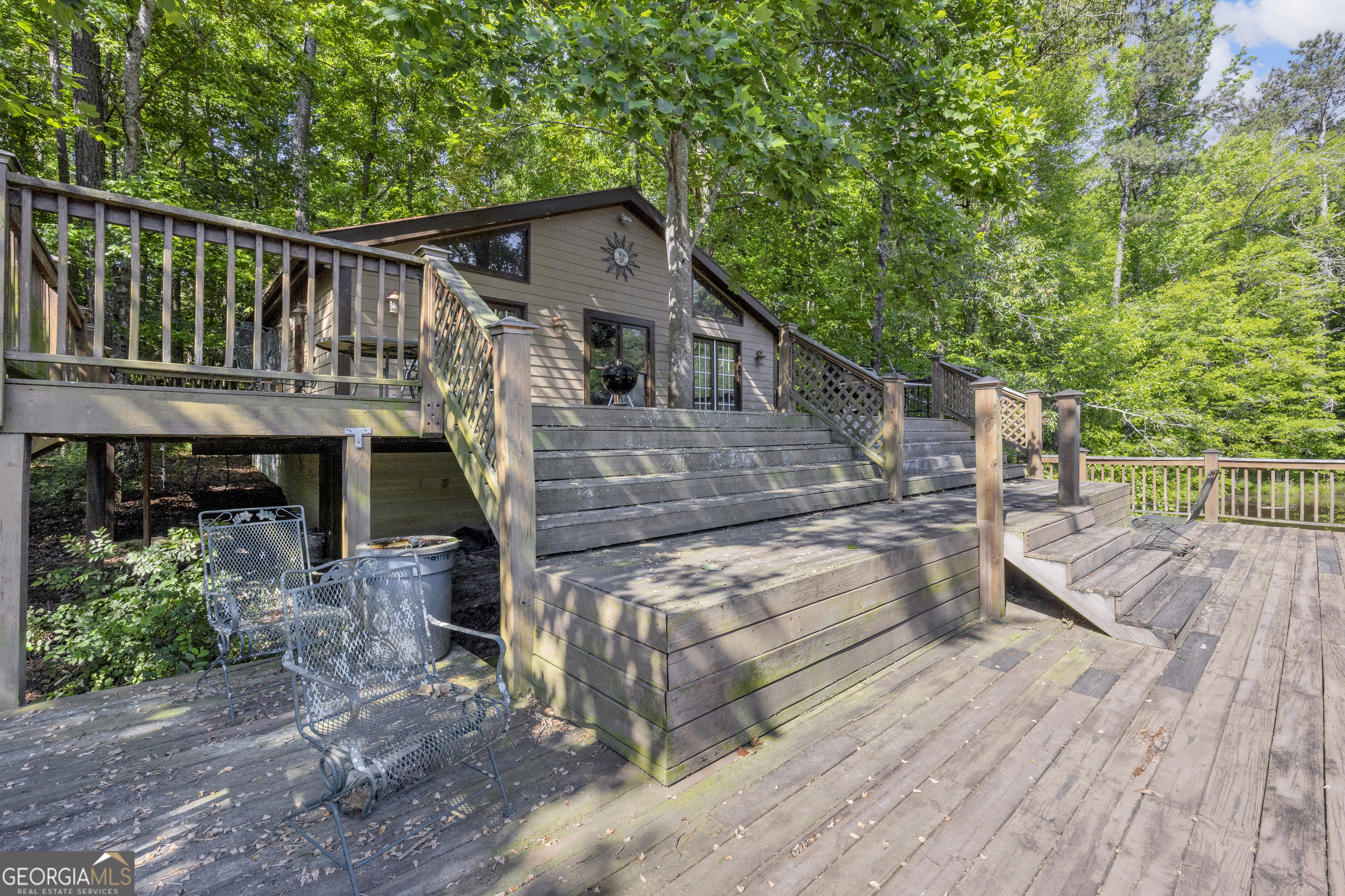 1641 Churchwell Rd Union Point Union Point, GA 30669 - Photo 7 of 48 a house view with a deck and a garden