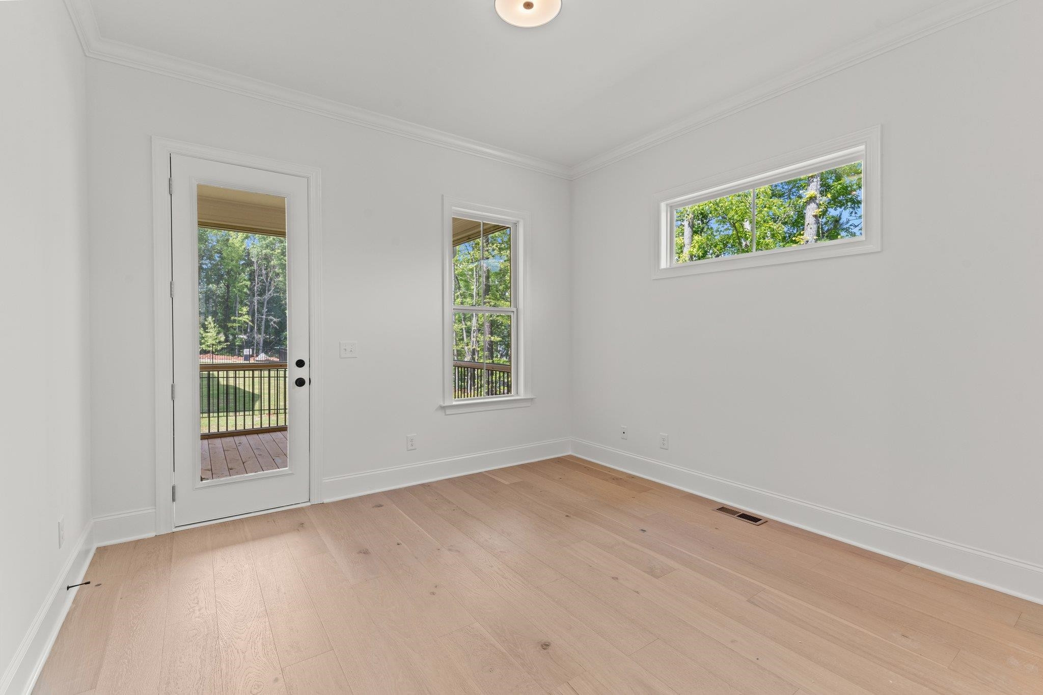9316 Field Maple Court Raleigh, NC 27613 - Photo 31 of 42 First floor guest suite with access to porch