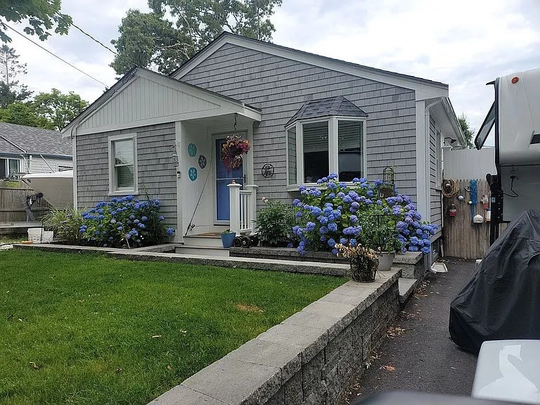 a front view of house with yard and green space