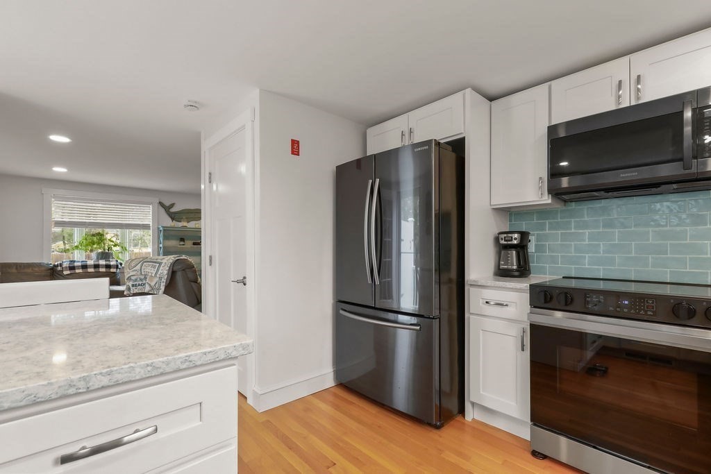 13 Monack Road Wareham, MA 02532 - Photo 13 of 28 a kitchen with a refrigerator stove and microwave