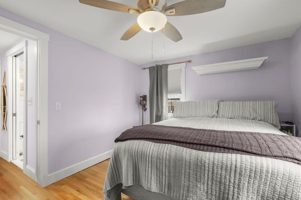 13 Monack Road Wareham, MA 02532 - Photo 19 of 28 a bedroom with a bed and a chandelier