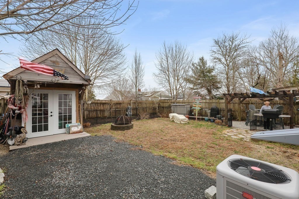 13 Monack Road Wareham, MA 02532 - Photo 27 of 28 a view of a house with a patio and a yard