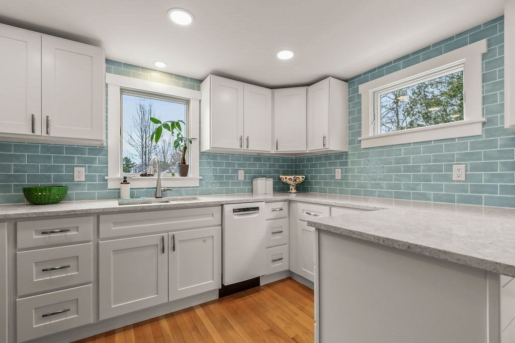 13 Monack Road Wareham, MA 02532 - Photo 10 of 28 a kitchen with white cabinets and sink
