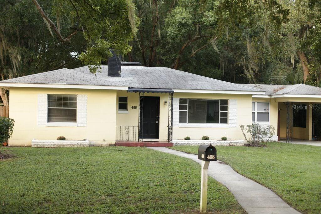 408 South Elm Road Lakeland, FL 33801 - Photo 1 of 1 a front view of house with yard and green space