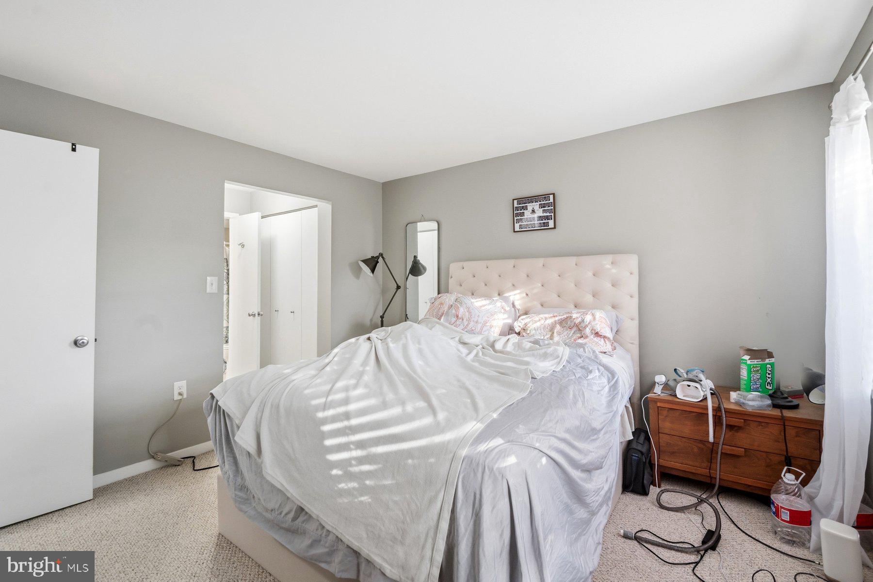 642 South Charles Street, Unit R 22 Baltimore, MD 21230 - Photo 20 of 26 a bedroom with a bed and a window