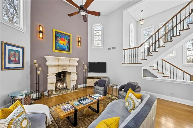 a living room with furniture fireplace and a flat screen tv