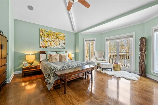 a bedroom with furniture and a wooden floor