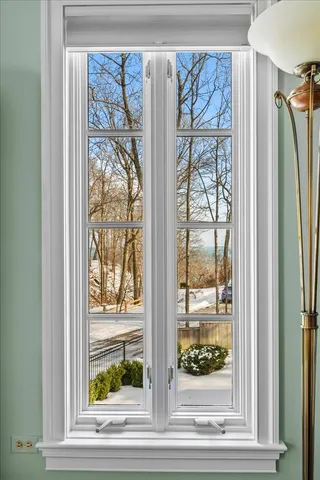 a view of a wooden floor and a red door