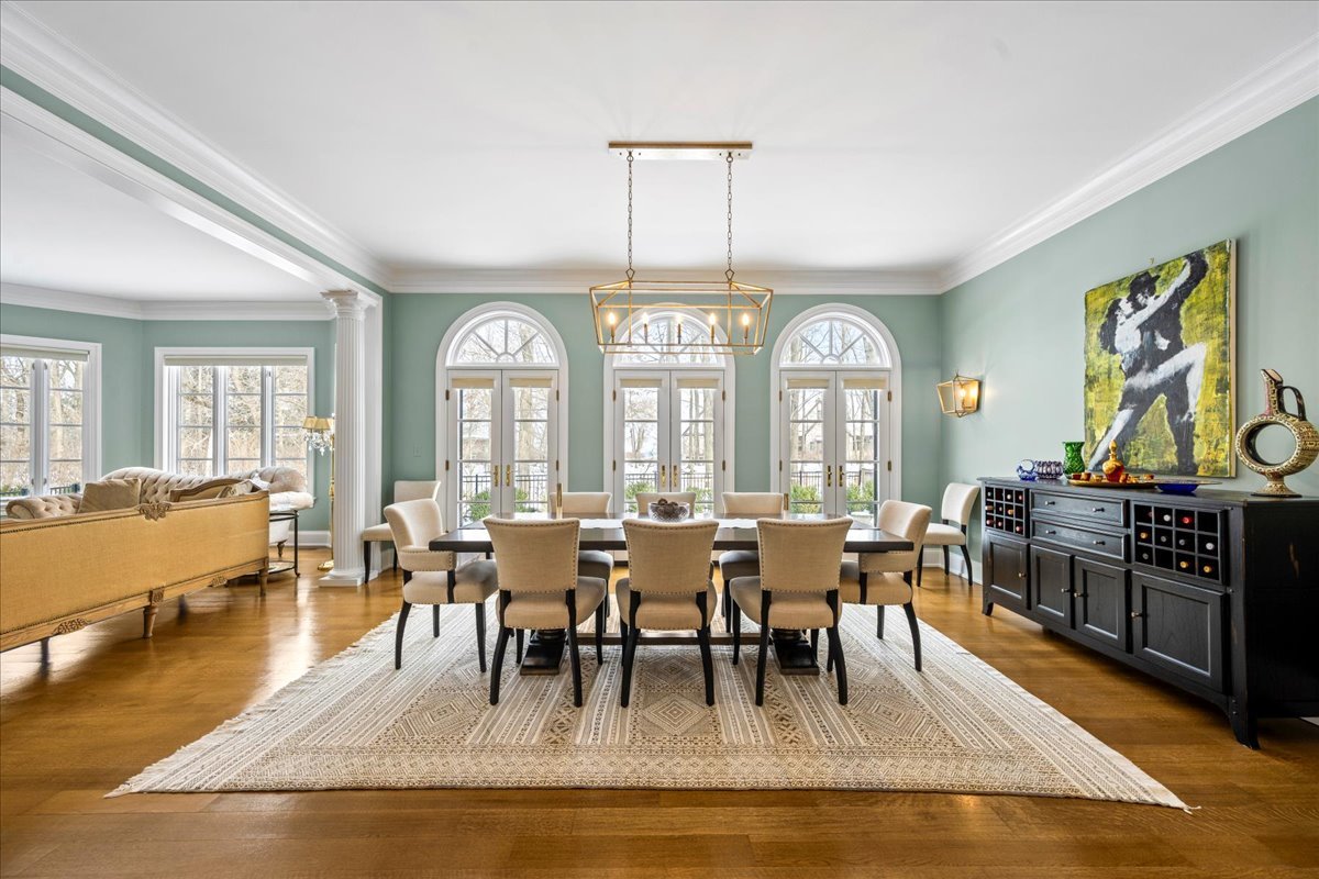 697 Bluff Road Lake Bluff, IL 60044 - Photo 8 of 47 a view of a dining room with furniture a chandelier and wooden floor