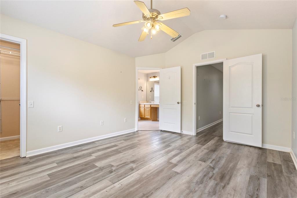 8324 72nd Lane East Bradenton, FL 34201 - Photo 12 of 50 wooden floor in an empty room with a window