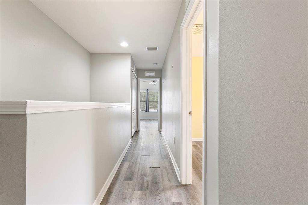 8324 72nd Lane East Bradenton, FL 34201 - Photo 16 of 50 a view of a hallway with wooden floor