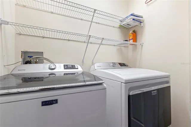 a utility room with dryer and washer