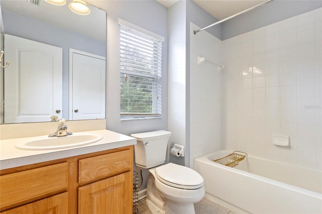 8324 72nd Lane East Bradenton, FL 34201 - Photo 23 of 50 a bathroom with a sink a toilet and a bathtub