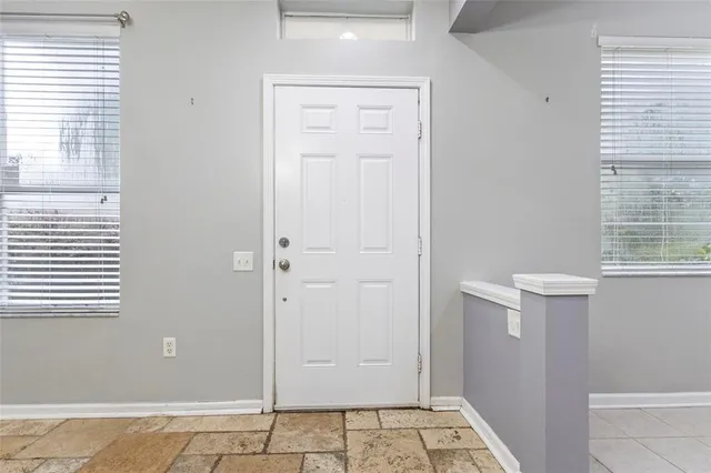 a view of an empty room with a window