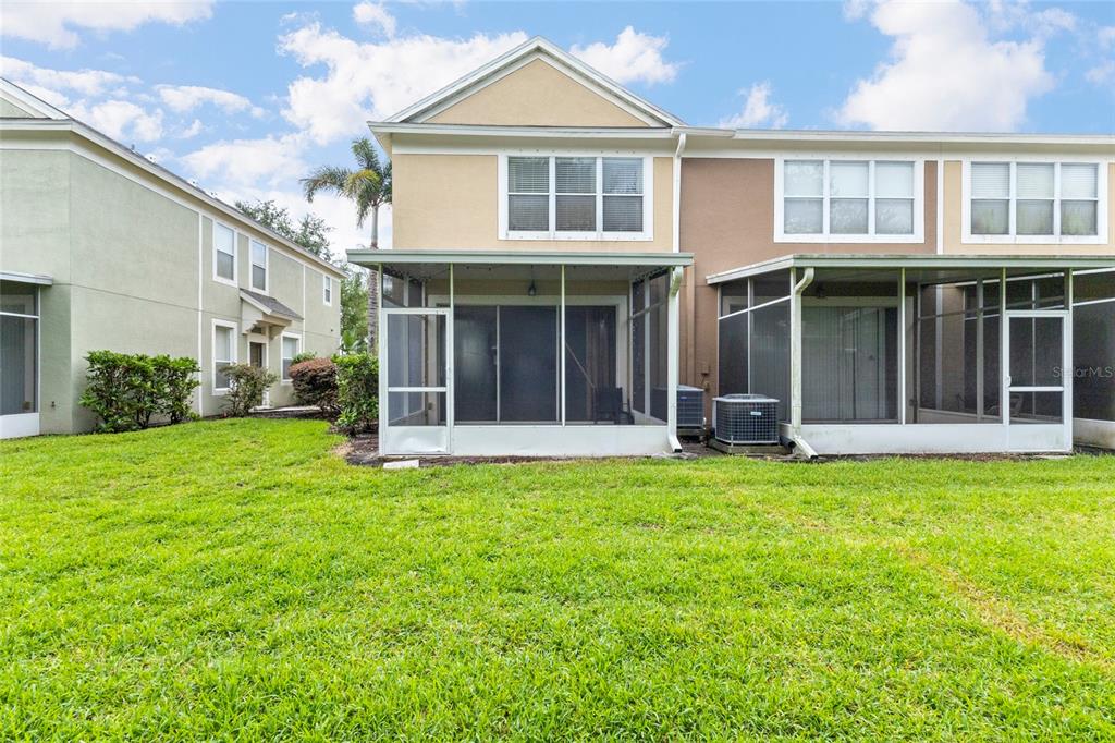 8324 72nd Lane East Bradenton, FL 34201 - Photo 39 of 50 a view of a white house with a large windows and a yard
