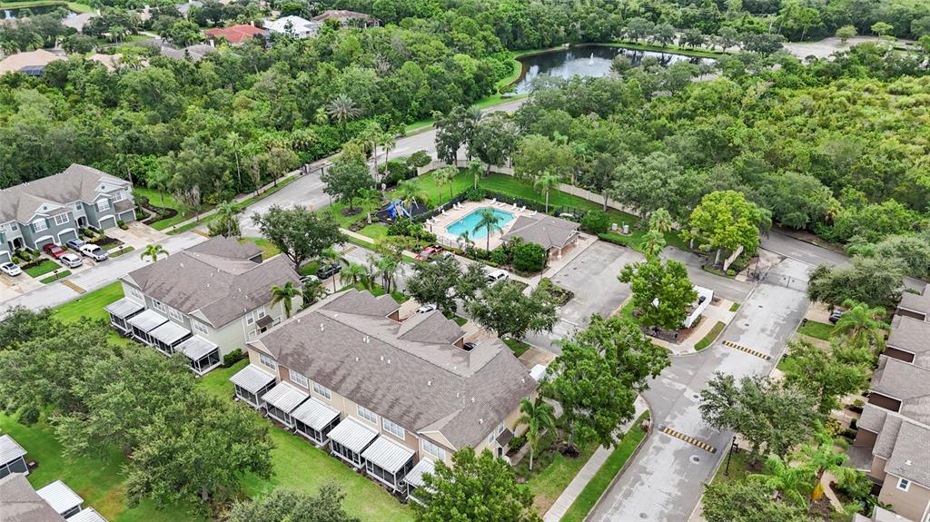 8324 72nd Lane East Bradenton, FL 34201 - Photo 44 of 50 an aerial view of residential house with outdoor space and trees all around