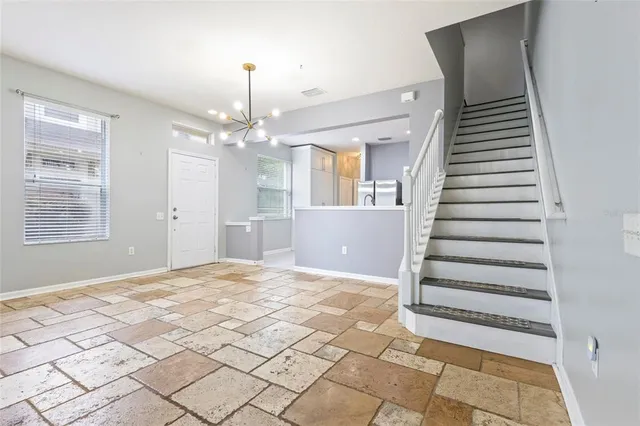a view of a hallway with front door and entryway