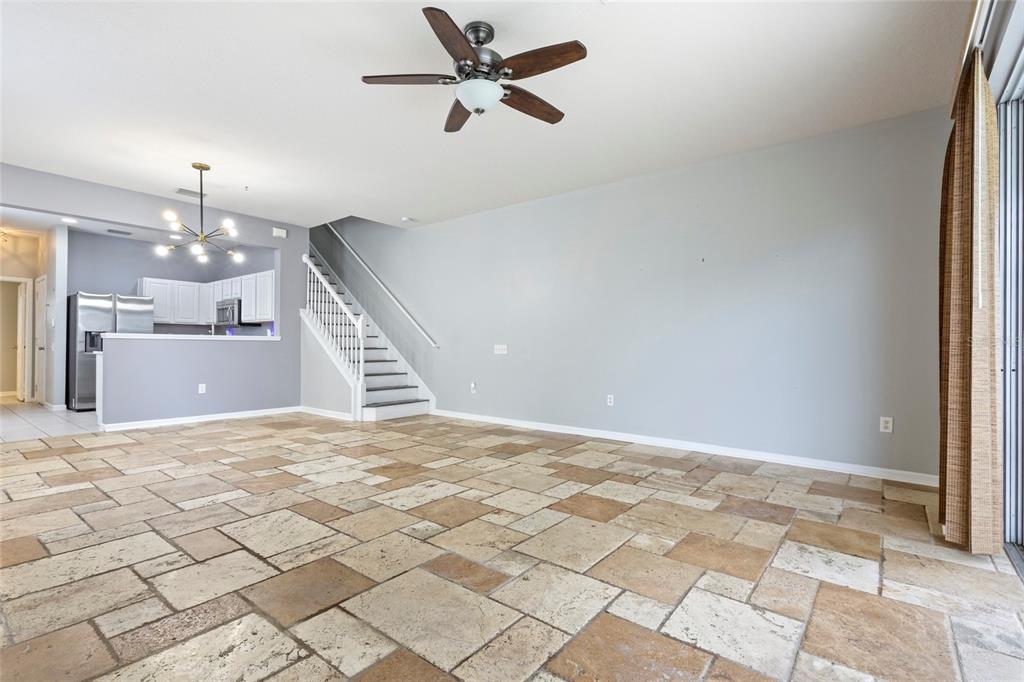 8324 72nd Lane East Bradenton, FL 34201 - Photo 7 of 50 wooden floor in an empty room with a chandelier fan