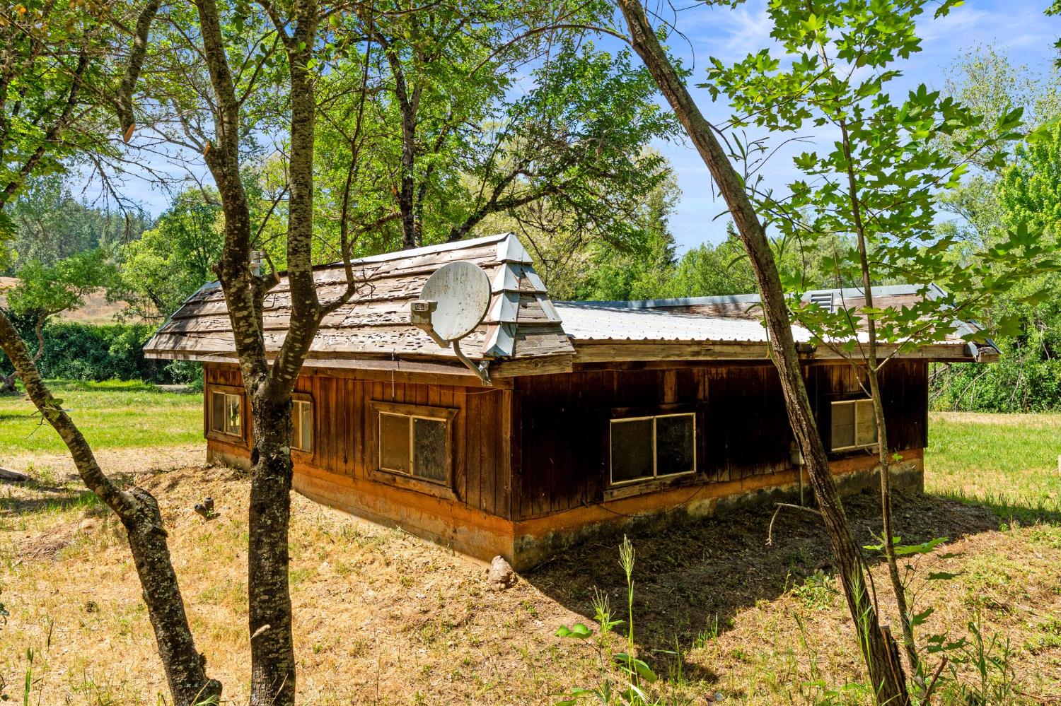 13433 Newtown Road Nevada City, CA 95959 - Photo 8 of 33 a view of house with backyard space and seating