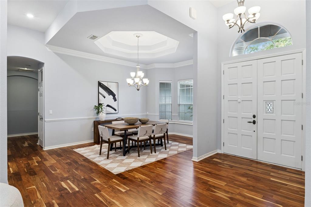 2125 Kane Park Way Windermere, FL 34786 - Photo 11 of 63 a view of a dining room with furniture and chandelier
