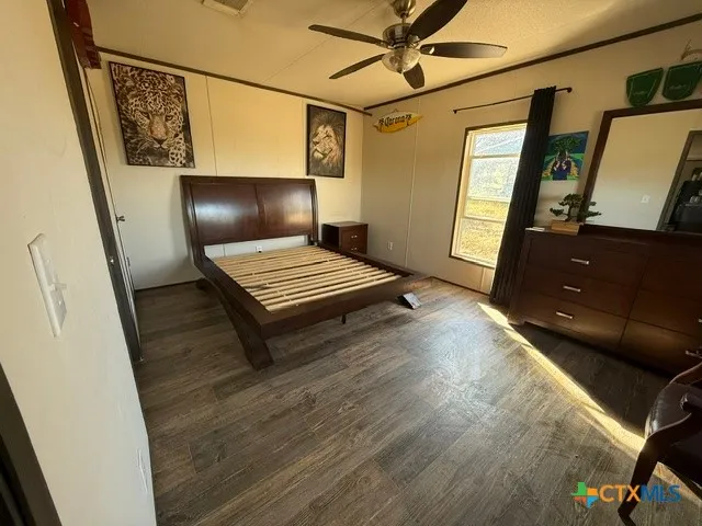 a view of room with window and wooden floor