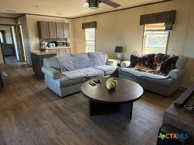 a living room with furniture and a window