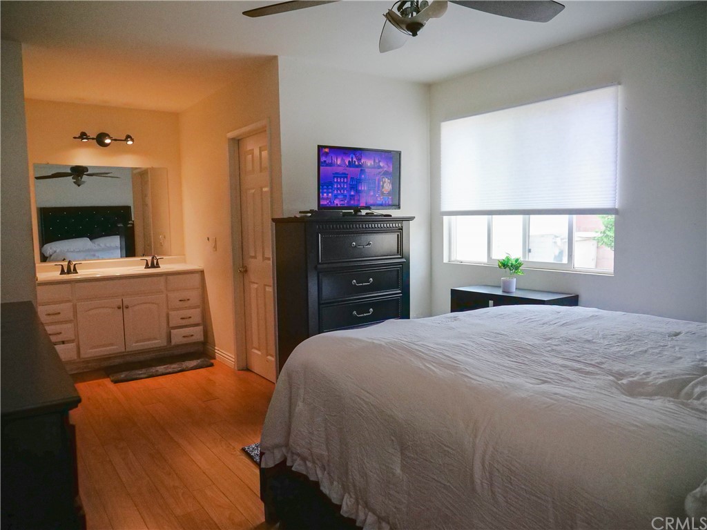 4613 Dunrobin Avenue Lakewood, CA 90713 - Photo 16 of 30 a bedroom with a bed and a dresser in it