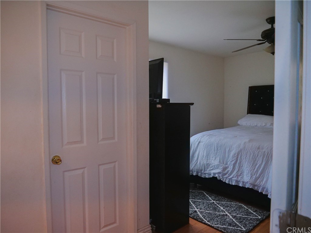 4613 Dunrobin Avenue Lakewood, CA 90713 - Photo 18 of 30 a bedroom with a bed and a window
