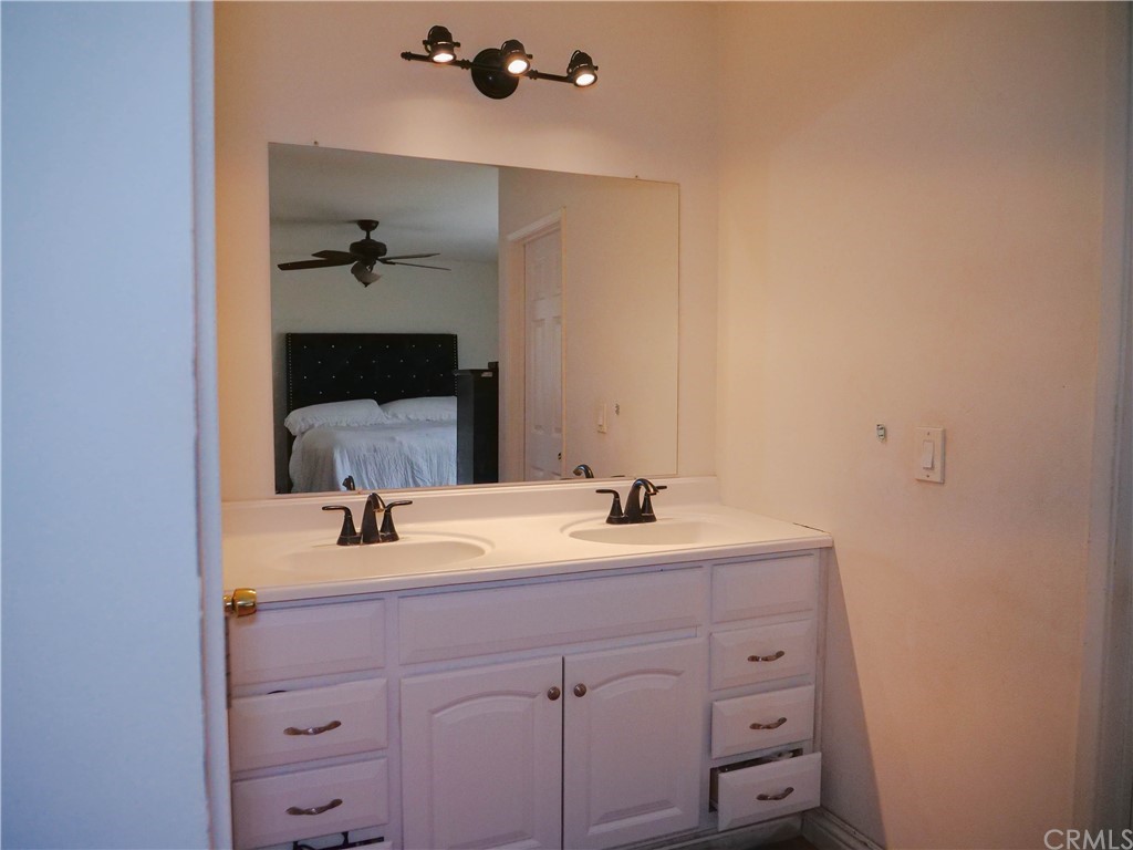 4613 Dunrobin Avenue Lakewood, CA 90713 - Photo 20 of 30 a bathroom with a sink and a mirror