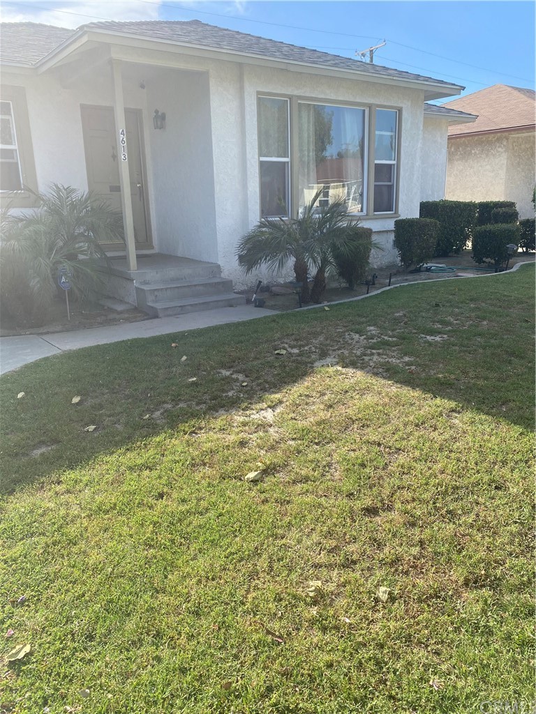 4613 Dunrobin Avenue Lakewood, CA 90713 - Photo 2 of 30 a view of a house with a yard