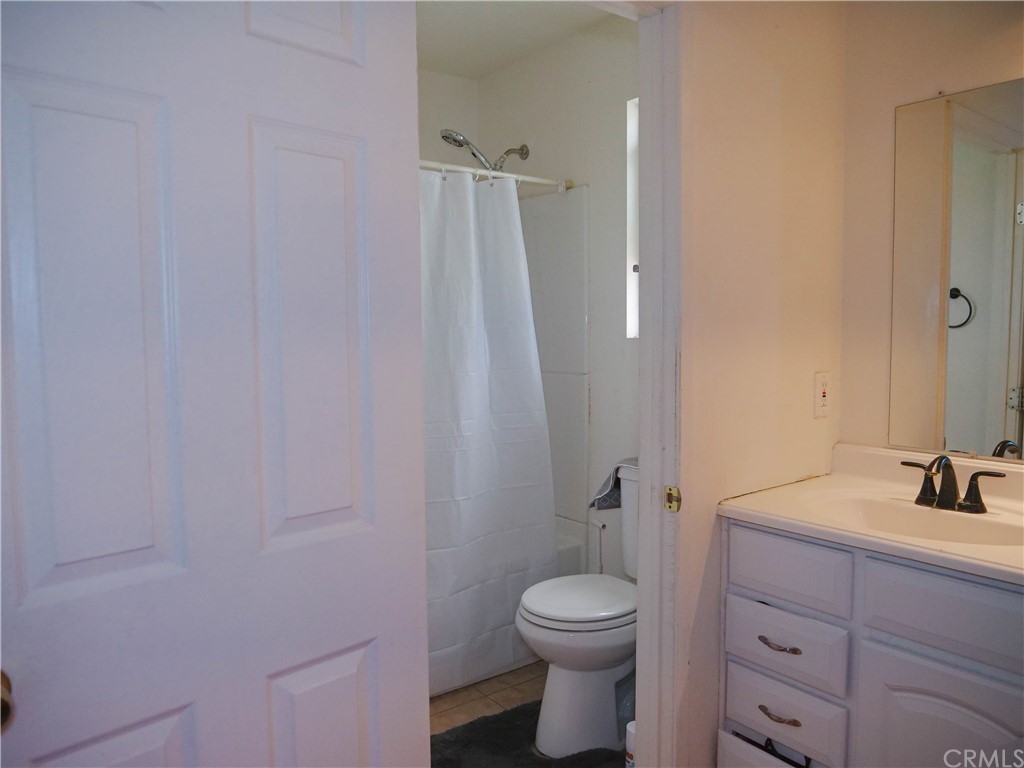 4613 Dunrobin Avenue Lakewood, CA 90713 - Photo 21 of 30 a bathroom with a sink a toilet and shower