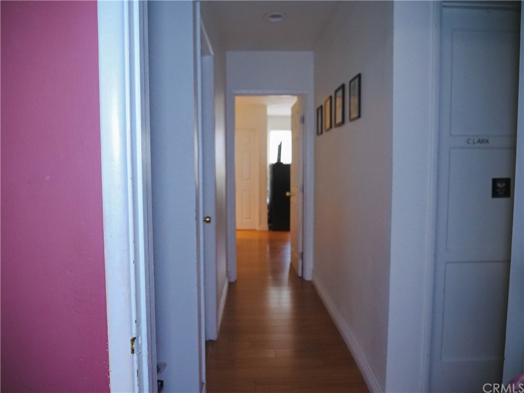 4613 Dunrobin Avenue Lakewood, CA 90713 - Photo 24 of 30 a view of a hallway with wooden floor