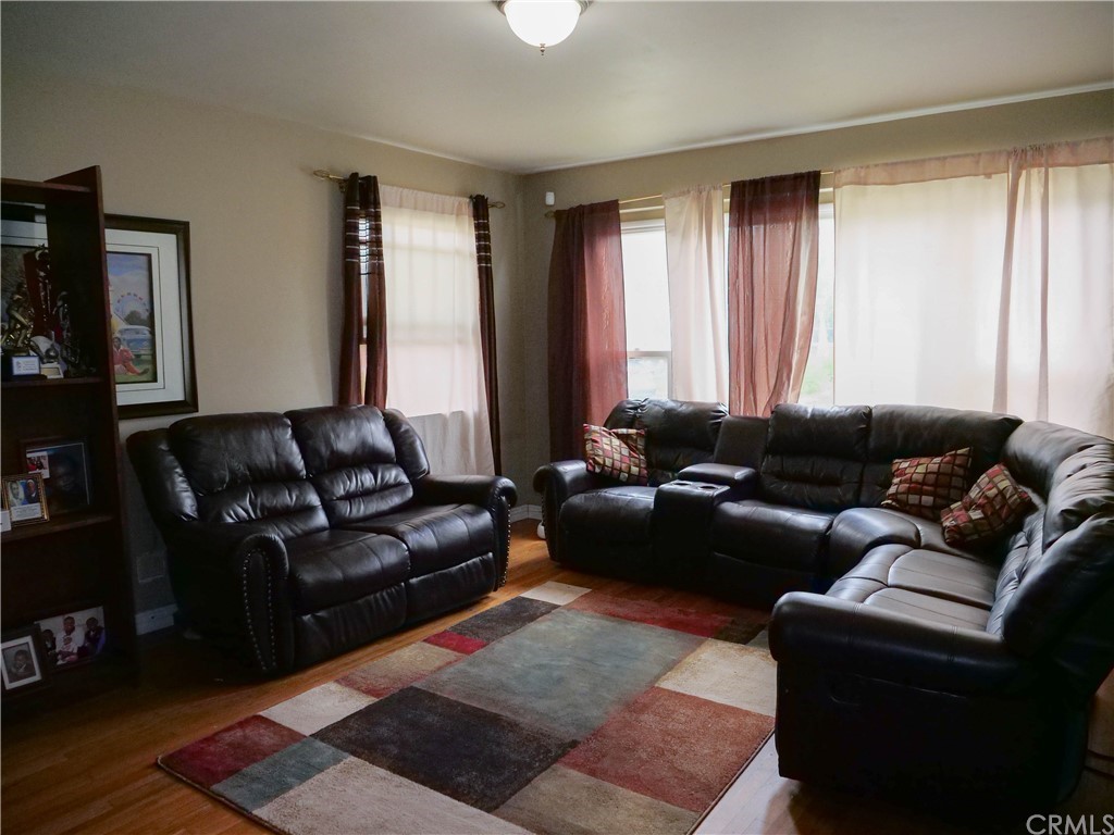 4613 Dunrobin Avenue Lakewood, CA 90713 - Photo 5 of 30 a living room with furniture and a window