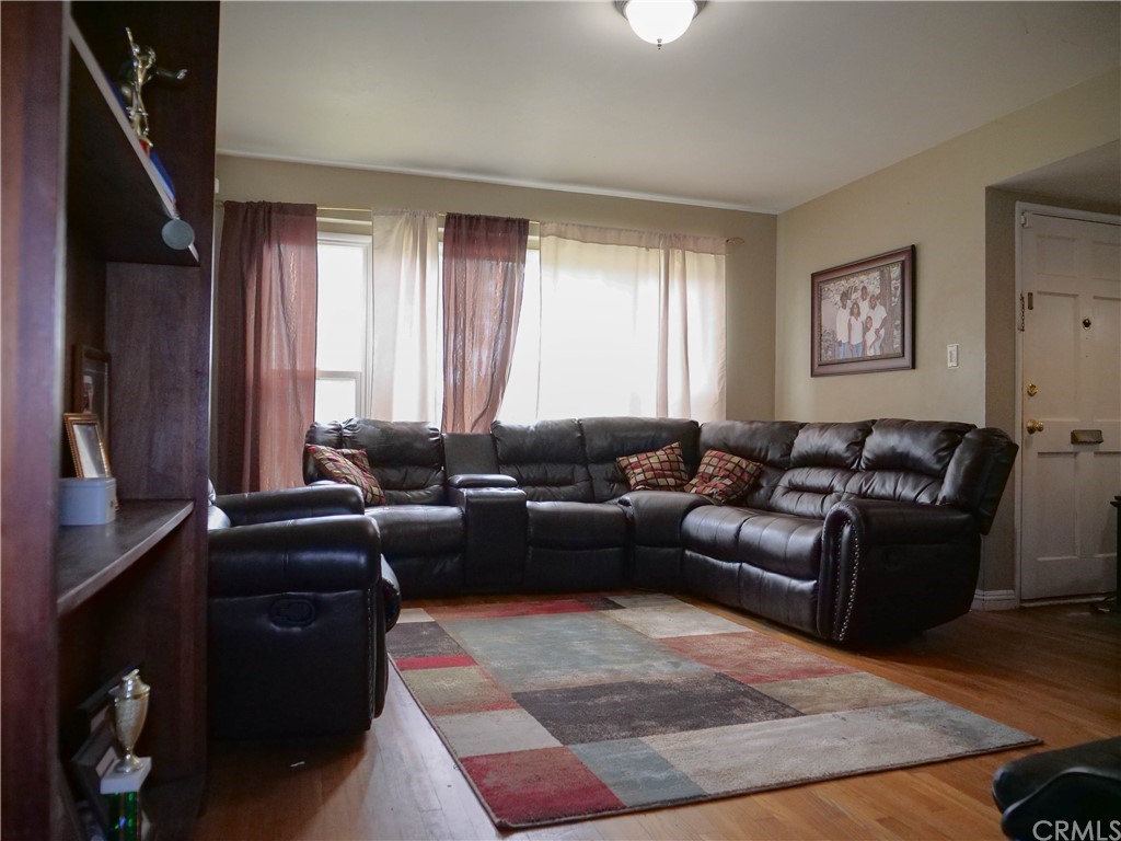 4613 Dunrobin Avenue Lakewood, CA 90713 - Photo 6 of 30 a living room with furniture and a window