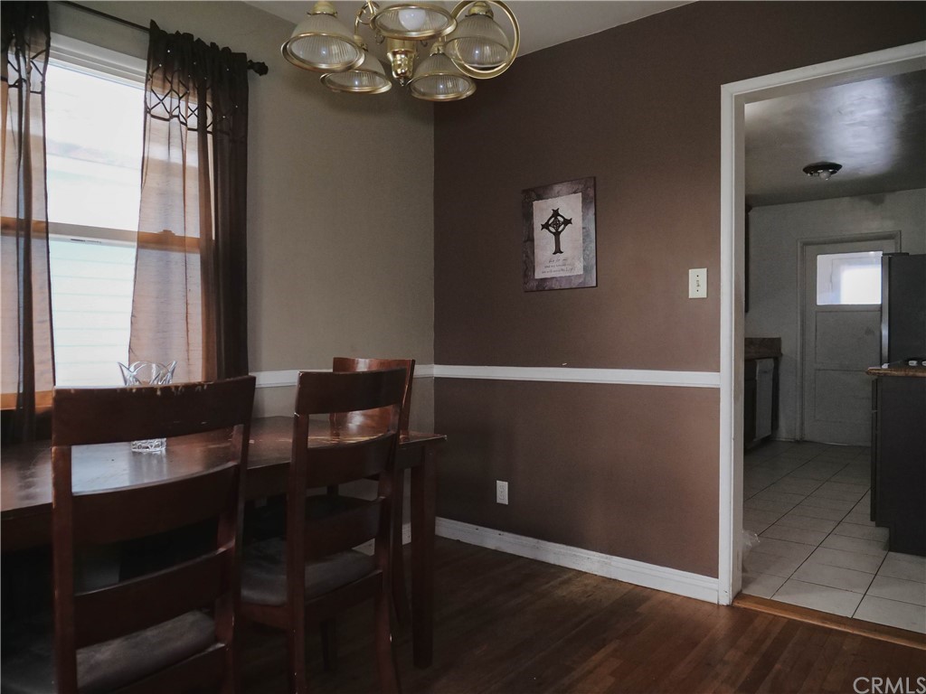 4613 Dunrobin Avenue Lakewood, CA 90713 - Photo 8 of 30 a view of a dining room with furniture and a chandelier